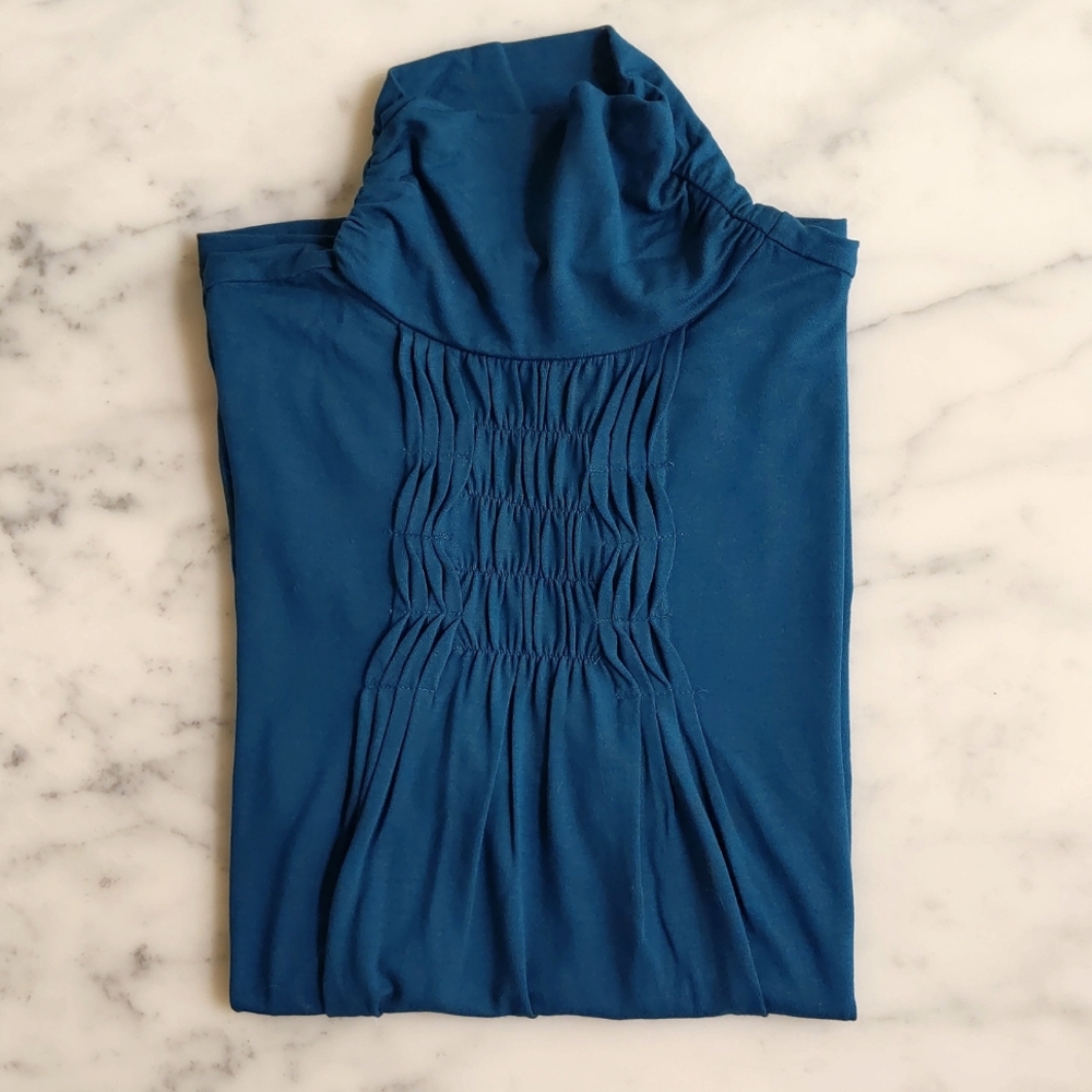 NWOT. The Limited Rayon and Spandex Front and Neck Design Short Sleeve Blouse.